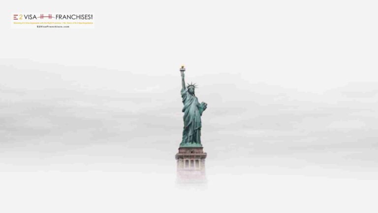 Liberty statue surrounded by clouds
